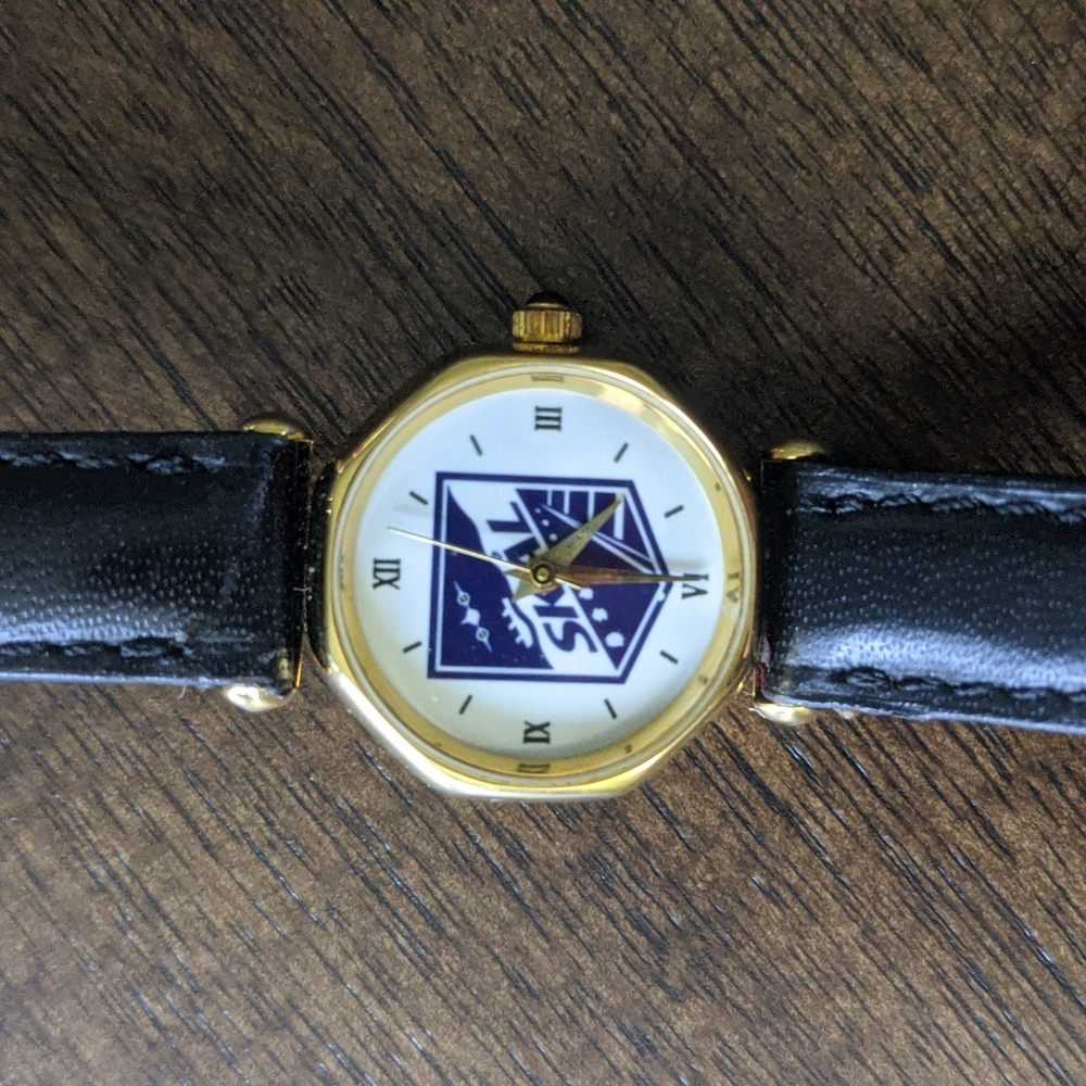 Skal gold watch with navy leather band